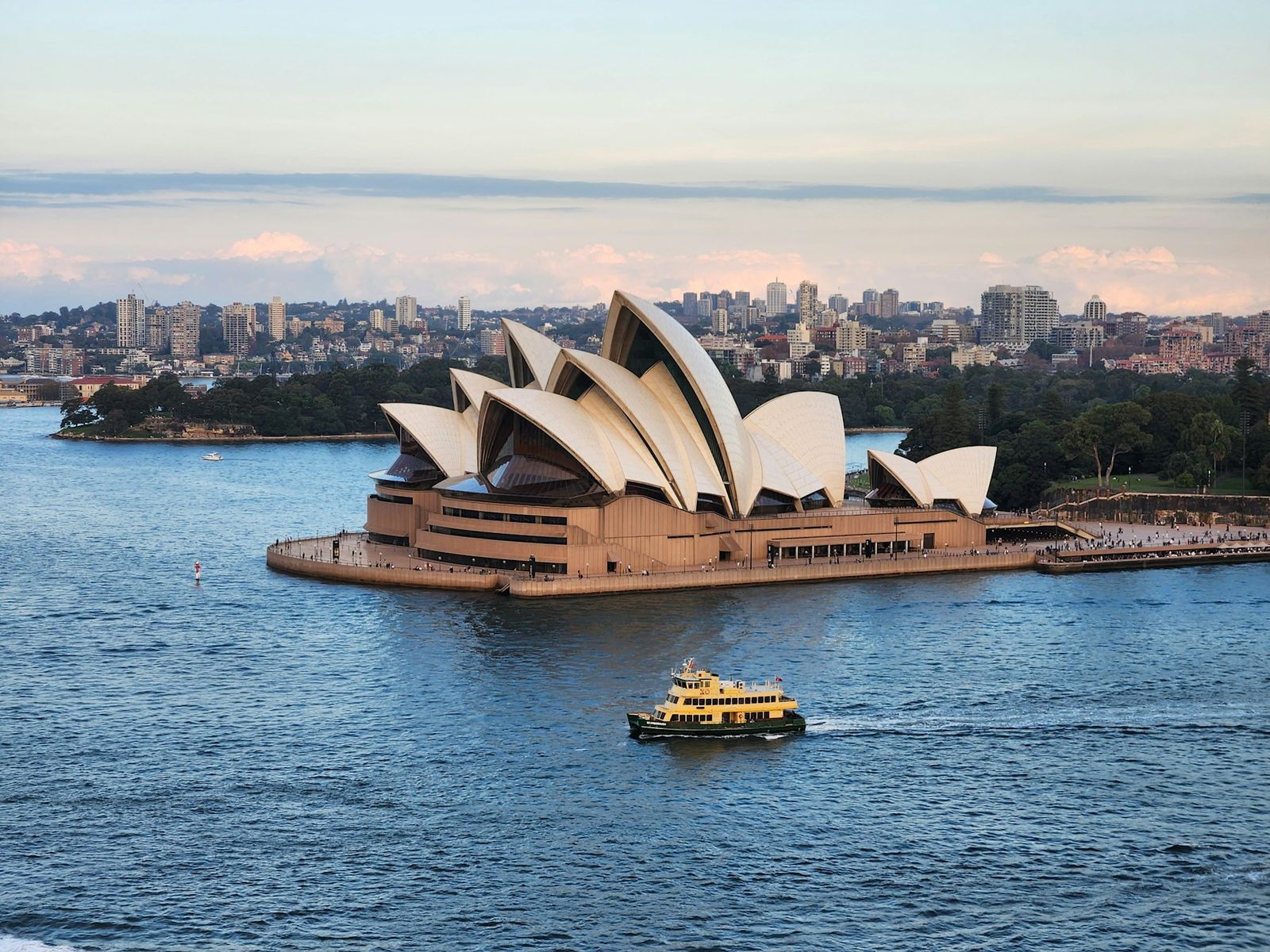 A ferry crossing Sydney Harbour past the Opera House